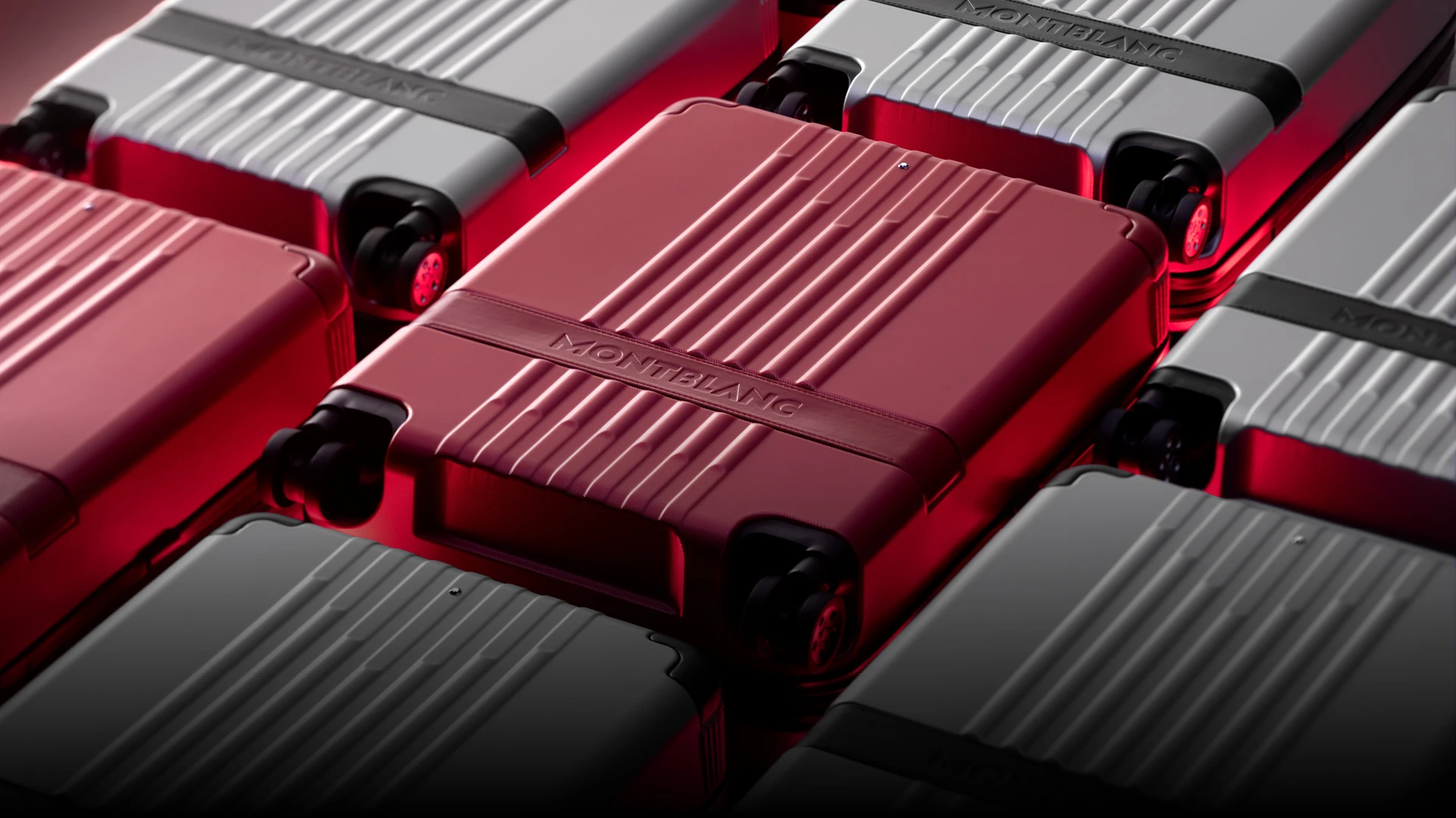 CGI Rendering von mehreren Montblanc Koffern, zwei davon sind rot